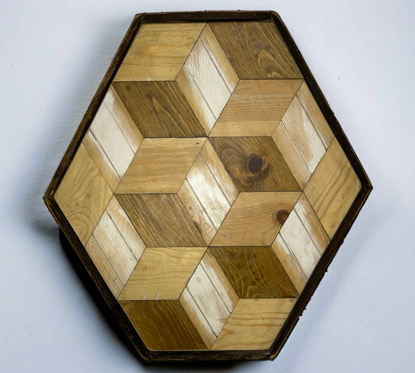 A Six Sided Piece of Reclaimed Wood Wall Art with White Flashes.