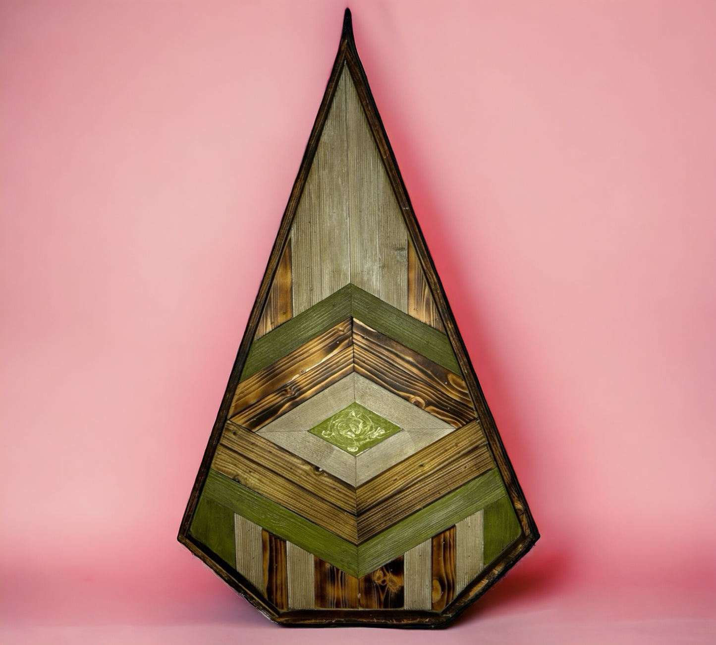 A Patterned Pointed Dynamic Green Piece of Reclaimed Wood Wall Art.